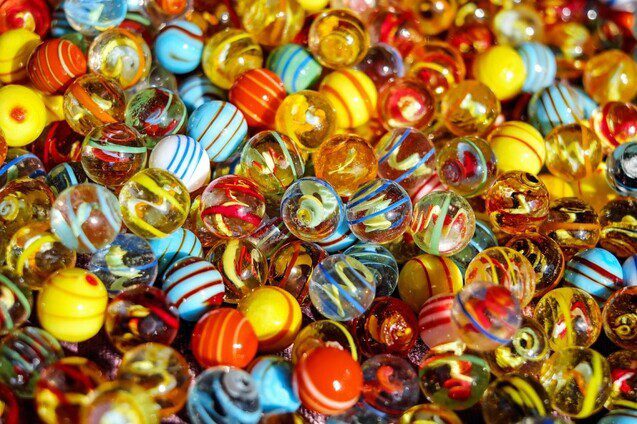 Vibrant close-up of colorful glass marbles with striped and swirled patterns